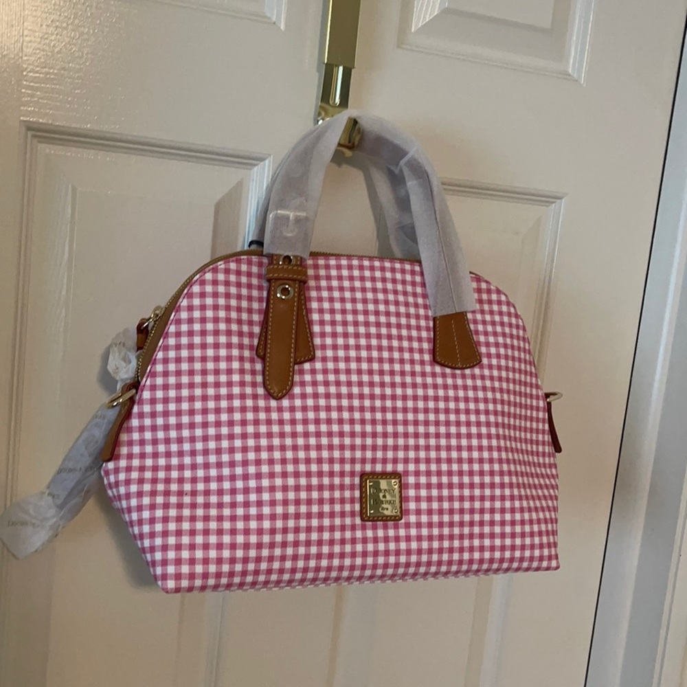 A pink and white check Dooney and Bourke bag.